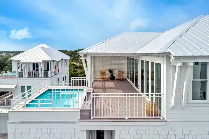 Serenity meets style featuring a stunning pool and cozy seating.