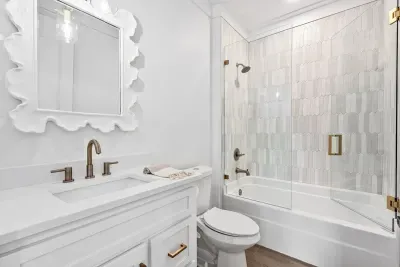 Bright and fresh bathroom with a combination tub and shower, perfect for unwinding.