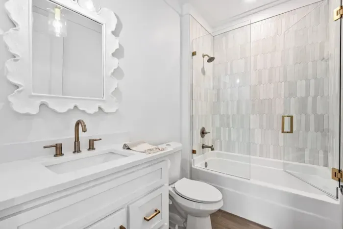 Bright and fresh bathroom with a combination tub and shower, perfect for unwinding.