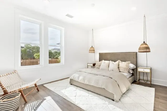 Modern bedroom with minimalist design and high-quality bedding.