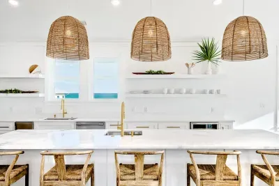 Spacious kitchen with a large island and seating, ideal for enjoying morning coffee or group meal prep.