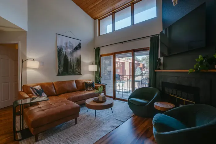 Relax in this upscale seating area complete with plush furnishings, natural light, and effortless mountain-modern style.