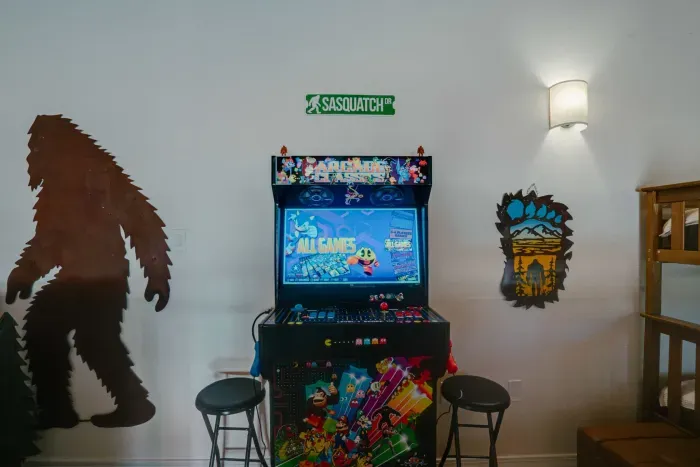 Additional cozy seating and entertainment options in this playful guest room.