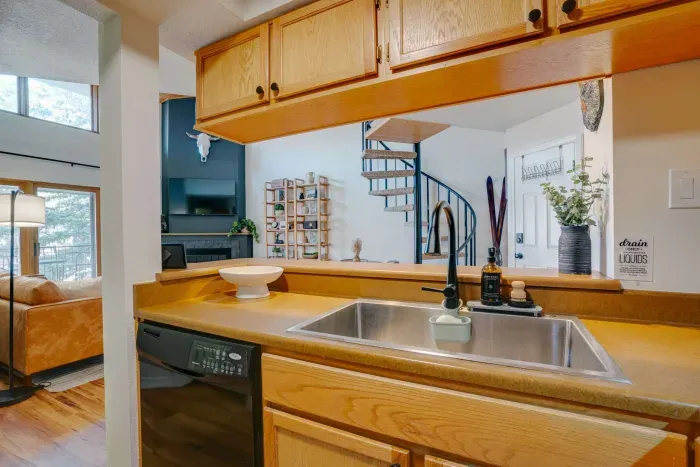 Bright and functional cooking space featuring a wide serving bar perfect for group meals.