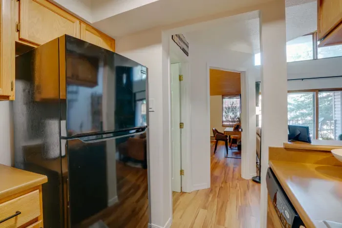 A fully equipped chef-friendly kitchen with upgraded appliances and natural wood cabinetry.