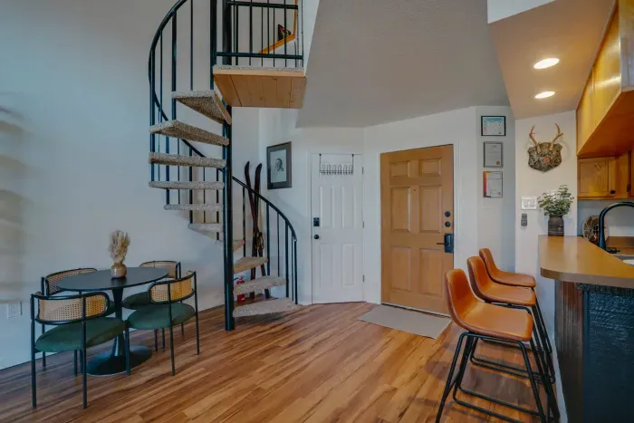 A welcoming entryway with rustic details and soft lighting, offering true Rocky Mountain charm as soon as you walk in.