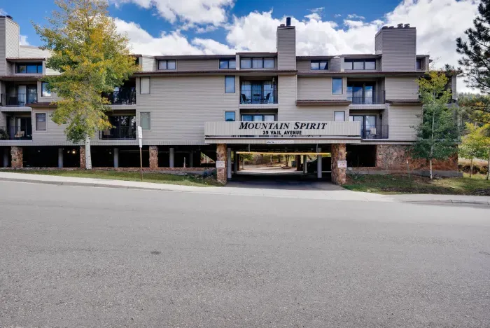 Welcoming building frontage with beautiful fall colors and mountain character.