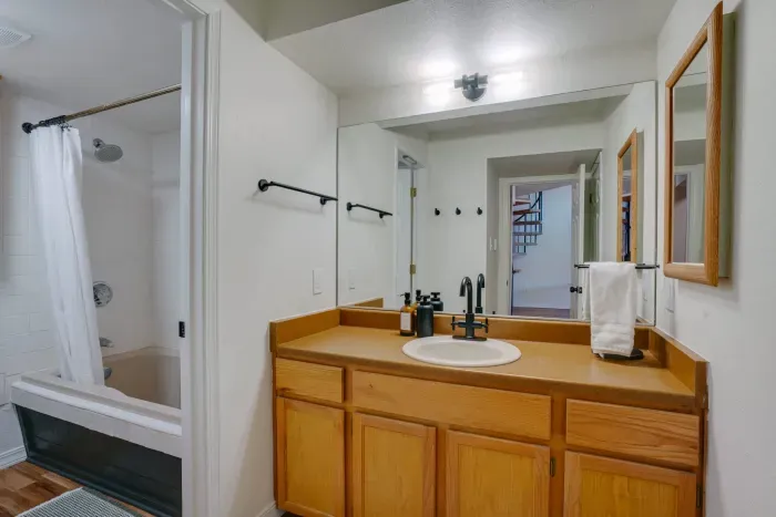 A clean, well-designed bathroom offering plenty of counter space and fresh linens.