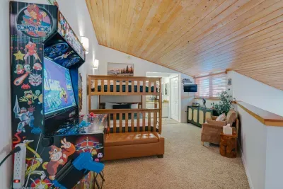 A beautifully styled guest bedroom offering warm wood accents and a serene mountain-cabin feel for a peaceful Angel Fire getaway.