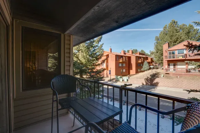 A peaceful retreat overlooking the pines, perfect for morning coffee, fresh air, or unwinding after a day on the slopes.