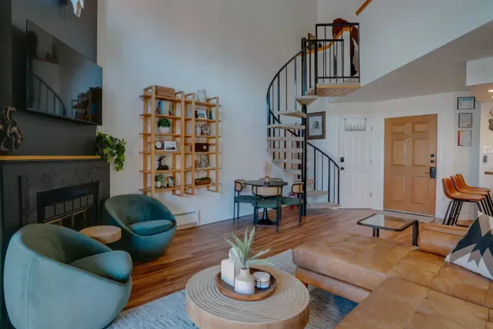 A stylish gathering area with curated art, soft textures, and spacious seating designed for après-ski relaxation.