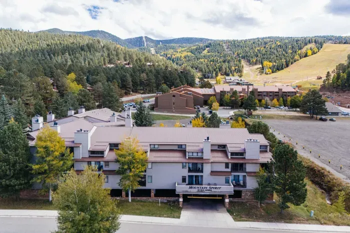 A premium perspective capturing the entire resort community and surrounding peaks.