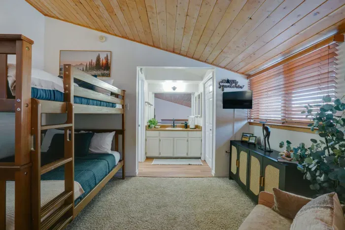 Another angle showcasing the spacious bunk layout with plenty of room for guests.