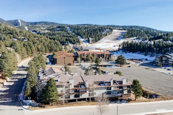 Panoramic mountain scenery showcasing ski runs and the surrounding alpine landscape.
