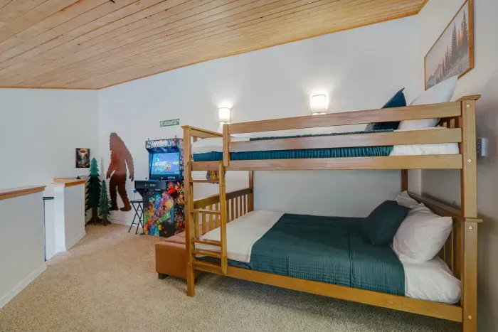A thoughtfully designed guest room with bunk beds, perfect for families or groups seeking comfort and space near Angel Fire Resort.
