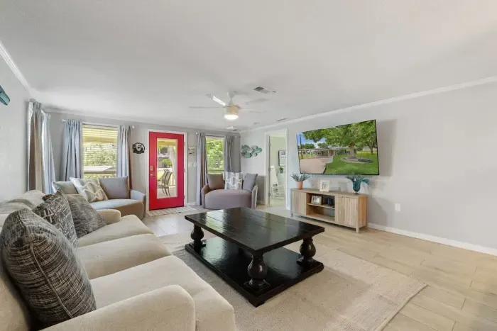 Cozy living room with plush seating and a large TV for movie nights or relaxing afternoons.