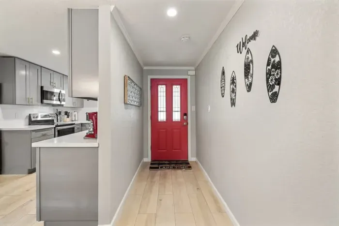 Welcome to a beautiful entrance that sets the tone for the rest of the home. With inviting décor, soft lighting, and a spacious layout, it creates a warm and stylish first impression.