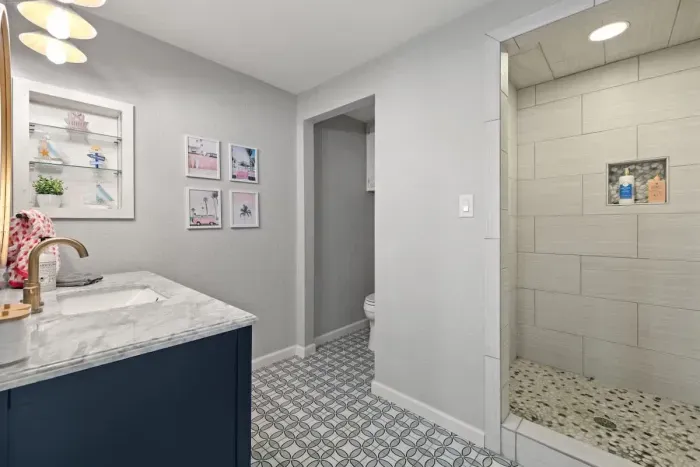 A refreshing, clean bathroom with charming decor and all the essentials.