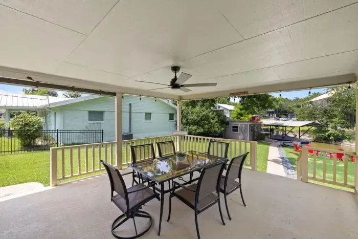 Covered patio dining area ideal for meals outdoors.
