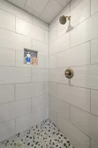 Step into a rainfall shower with endless hot water, ready to recharge you after a day of exploring.