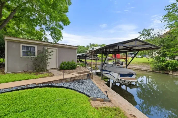 Spacious backyard offering direct access to a private boat, perfect for water enthusiasts. This unique feature enhances outdoor living, providing endless opportunities for adventure and relaxation. Ideal for those who love boating and seek a harmony.