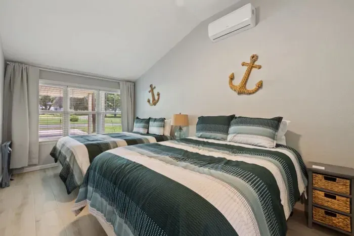 Family-friendly bedroom with two twin beds and fun, whimsical decor.