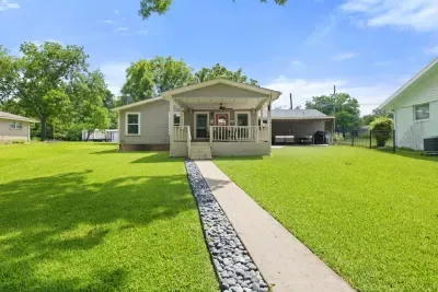 Well-maintained backyard with a variety of trees and shrubs for a natural, private setting.