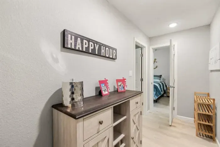 Step into a welcoming hallway that connects the different areas of the home. The spacious corridor is filled with natural light, offering easy access to the bedrooms, living spaces, and adding a sense of flow to the layout.