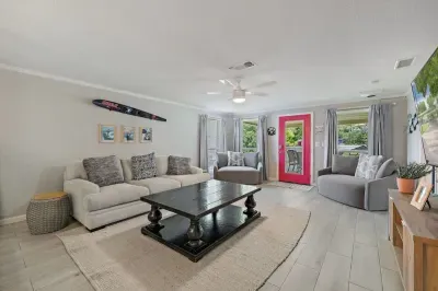 Living room - Plenty of seating for everyone. Catch your favorite game on the MASSIVE large screen or sit back and relax to play your favorite board/card game.