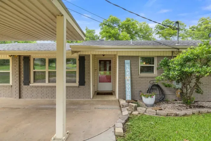 Welcoming entrance with charming curb appeal and lush landscaping.