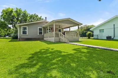 Serene backyard with a patio, ideal for dining al fresco or unwinding under the stars.