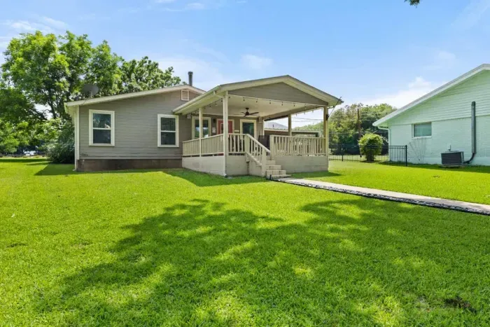Serene backyard with a patio, ideal for dining al fresco or unwinding under the stars.