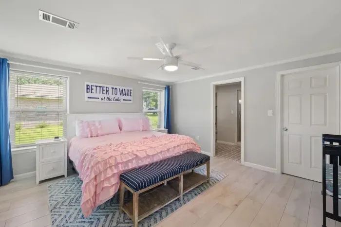 Peaceful bedroom with a plush queen-sized bed and soft linens for a restful night’s sleep.