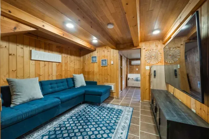 Stylish secondary living room featuring a comfortable sofa, ideal for movie nights or casual gatherings.