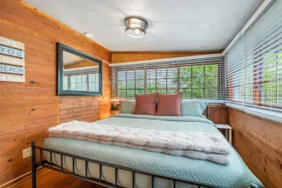 This room combines rustic charm with modern amenities, offering a king-size bed and cozy, earthy tones for a relaxed vibe.