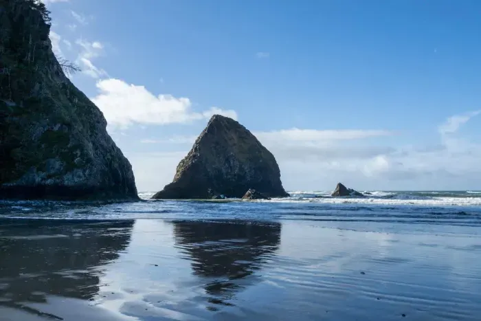 1. Stunning coastal getaway! Steps from the beach! This crming home (marked with a red arrow) is nestled among the trees and breathtaking ocean views. Enjoy peaceful surroundings, easy beach access, and the beauty of nature ri