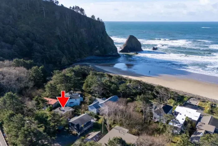2.Stunning coastal getaway! Steps from the beach! This charming home (marked with a red arrow) is nestled among the trees, offering both privacy and breathtaking ocean views. Enjoy peaceful surroundings, easy beach access, and the beauty of nature ri