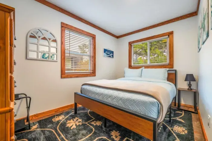 Featuring a plush bed and soothing color palette, this room is a serene escape from the world.