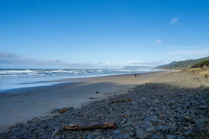 Stunning coastal getaway! Steps from the beach! This crming home (marked with a red arrow) is nestled among the trees and breathtaking ocean views. Enjoy peaceful surroundings, easy beach access, and the beauty of nature ri