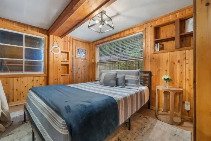 Peaceful bedroom with a plush queen-sized bed and soft linens for a restful night’s sleep.