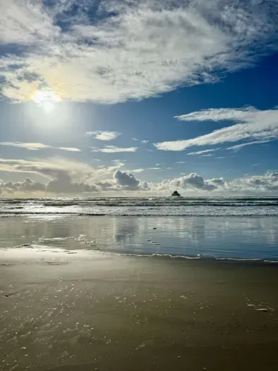 Stunning coastal getaway! Steps from the beach! This crming home (marked with a red arrow) is nestled among the trees and breathtaking ocean views. Enjoy peaceful surroundings, easy beach access, and the beauty of nature ri