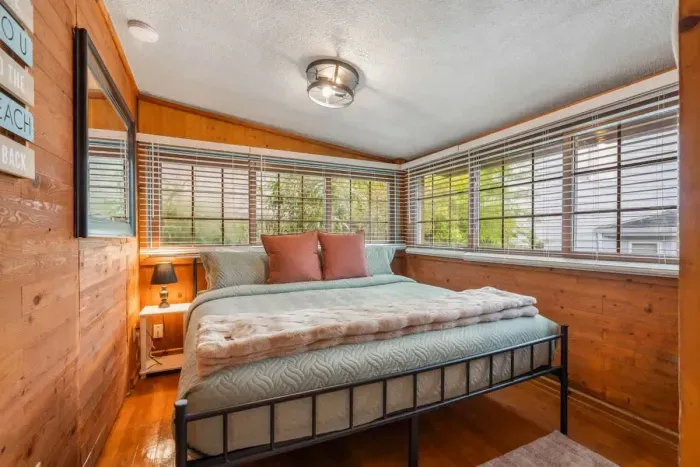 This room combines rustic charm with modern amenities, offering a king-size bed and cozy, earthy tones for a relaxed vibe.