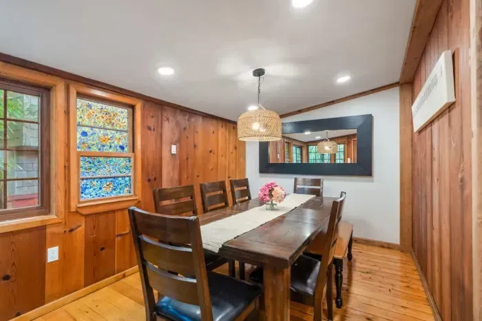 Cozy dining space with a farmhouse-style table and bench seating for a relaxed vibe.
