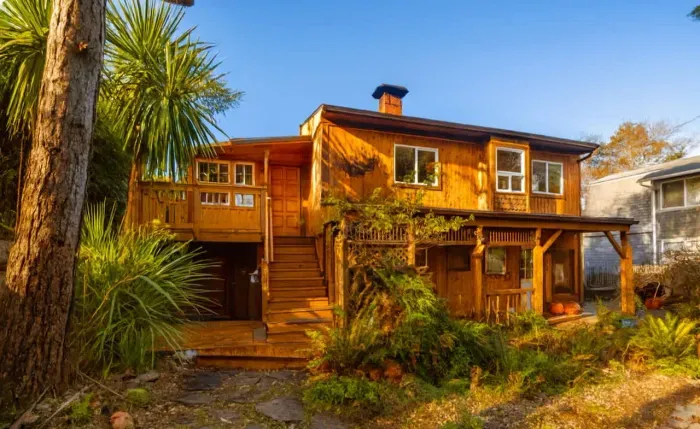 Welcoming entrance with charming curb appeal and lush landscaping.