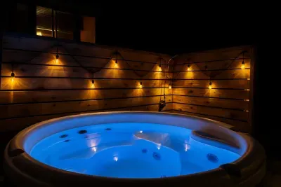 5. A privacy screen and lighting set the tone for a relaxing dip in the hot tub!