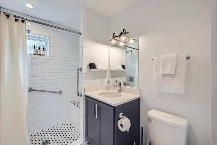 Enjoy the convenience and accessibility of a full bathroom equipped with ADA-compliant handles. Featuring modern fixtures and spacious design, this bathroom ensures both comfort and ease of use for all guests.