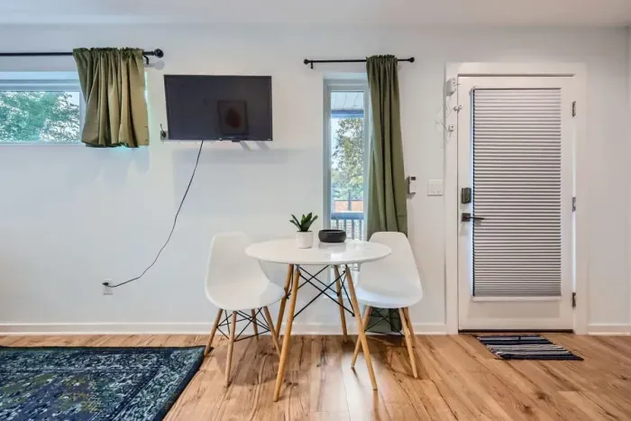 A cozy dining area to enjoy meals, games, or a glass of wine together.