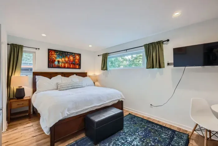 Rejuvenate with a good night's sleep in a spacious, serene bedroom.