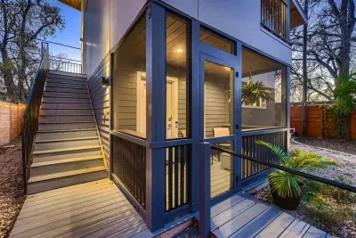 Warmly lit exterior at dusk showcasing the home’s modern architecture and inviting atmosphere.