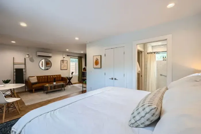 Sink into comfort in a plush bed with soft linens—perfect for a restful night’s sleep.